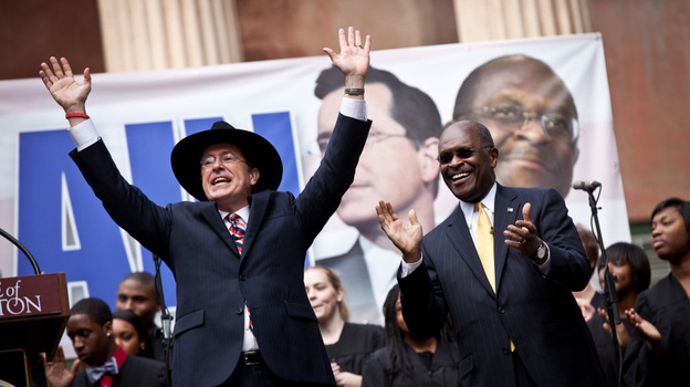 Comedian Stephen Colbert, left, holds a rally with former GOP presidential candidate Herman Cain at the College of Charleston in South Carolina. 