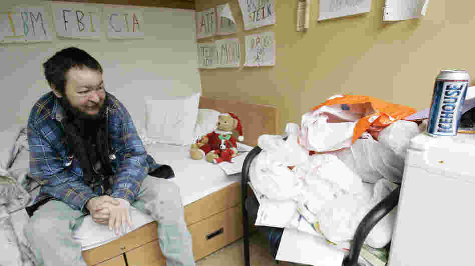 Brian Steik sits in his cubicle at a apartment building for homeless alcoholics in Seattle. 
