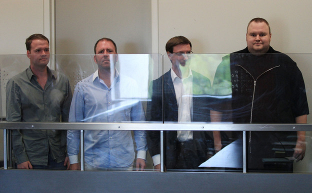 Megaupload.com employees Bram van der Kolk, also known as Bramos (from left); Finn Batato; Mathias Ortmann; and founder, former CEO and current Chief Innovation Officer Kim Dotcom appear in North Shore District Court in Auckland, New Zealand, on Friday. 