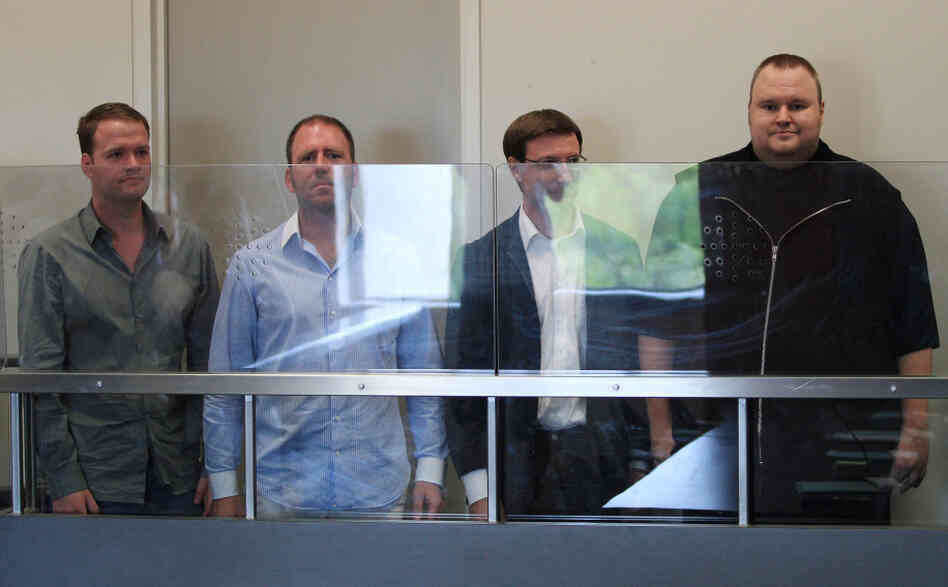 Megaupload.com employees Bram van der Kolk, also known as Bramos (from left); Finn Batato; Mathias Ortmann; and founder, former CEO and current Chief Innovation Officer Kim Dotcom appear in North Shore District Court in Auckland, New Zealand, on Friday. 