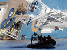 A coast guard boat passes the Costa Concordia, as the cruise liner lies aground in front of the harbor of Giglio Island. A coast guard boat passes the Costa Concordia, as the cruise liner lies aground in front of the harbor of Giglio Island.