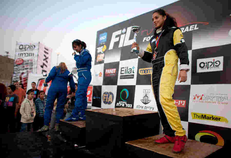 Noor Daoud holds a trophy after she won third place in the first day of Formula Israel's women's race, in Eilat, Israel. Daoud went on to take the women's title at the event.