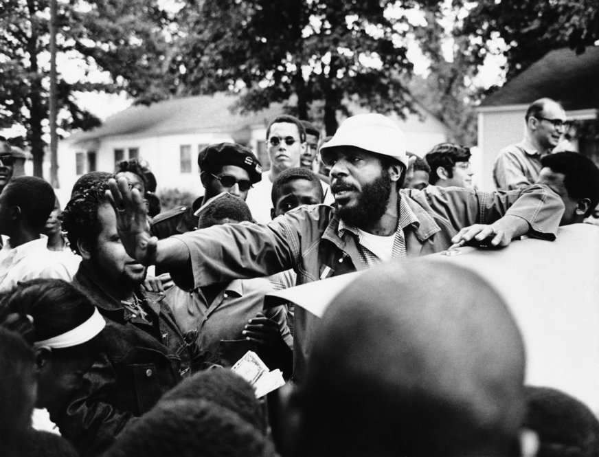 Dick Gregory, a social and political comedian, ran for president on the Peace and Freedom Party ticket. Here, he clears his way before speaking in Norfolk's Liberty Park, on Oct. 18, 1968. 