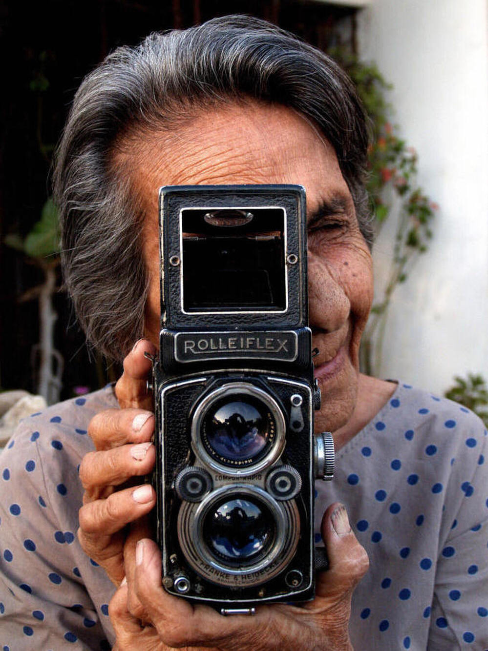 Homai Vyarawalla poses with her Rolleiflex camera at her home in Vadodara, India, on March 6, 2006.