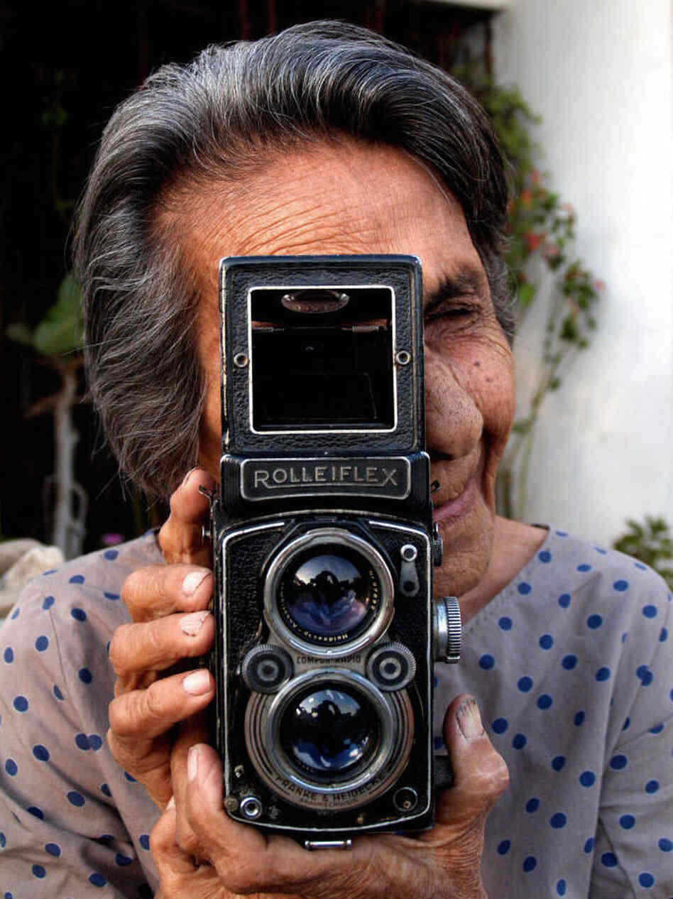 Homai Vyarawalla poses with her Rolleiflex camera at her home in Vadodara, India, on March 6, 2006.