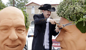Kinky Friedman trims the ivy growing as hair on a 6-foot bust of Gov. Rick Perry. In 2006, Friedman came in fourth in his bid to be governor of Texas, drawing in part on his fame as a country musician. He has also written several mystery novels.