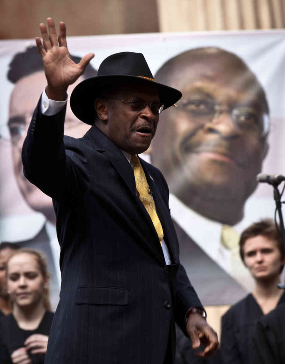 Former GOP presidential candidate Herman Cain waves at a rally the College of Charleston on January 20, 2012. Comedian Stephen Colbert held the event with Cain, titled "Rock Me Like a Herman Cain South Cain-olina Primary Rally", as part of his pseudo-run for president of "The United States of South Carolina." 