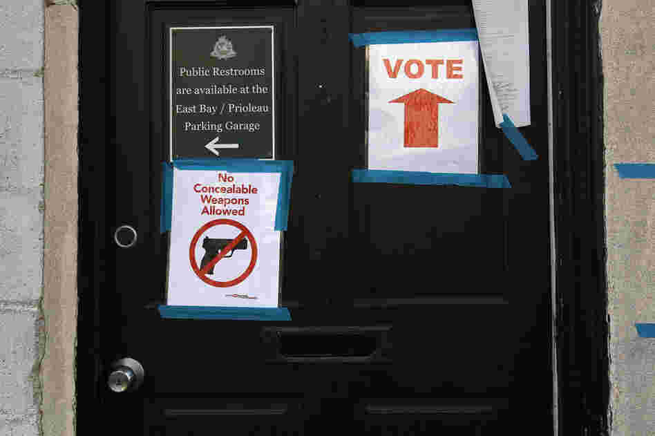 Signs adorn the doorway of a polling station in Charleston, S.C. 