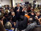 Newt Gingrich stands on an ice cooler while addressing the crowd at Tommy's Country Ham House. Newt Gingrich stands on an ice cooler while addressing the crowd at Tommy's Country Ham House.