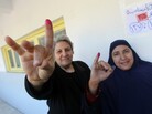 Egyptian women show their ink-stained fingers after voting at a polling station earlier this month. According to the election results, less than 2 percent of parliamentarians will be female. Egyptian women show their ink-stained fingers after voting at a polling station earlier this month. According to the election results, less than 2 percent of parliamentarians will be female.