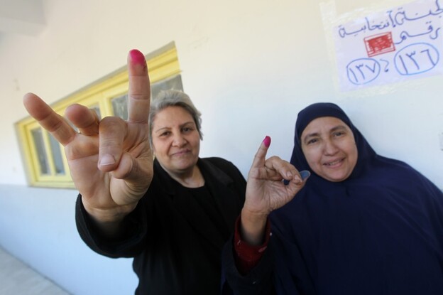Egyptian women show their ink-stained fingers after voting at a polling station earlier this month. According to the election results, less than 2 percent of parliamentarians will be female.