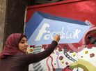 A student paints the Facebook logo on a mural commemorating Egypt's revolution last spring. The team from the CIA's Open Source Center monitors social media activity overseas. A student paints the Facebook logo on a mural commemorating Egypt's revolution last spring. The team from the CIA's Open Source Center monitors social media activity overseas.