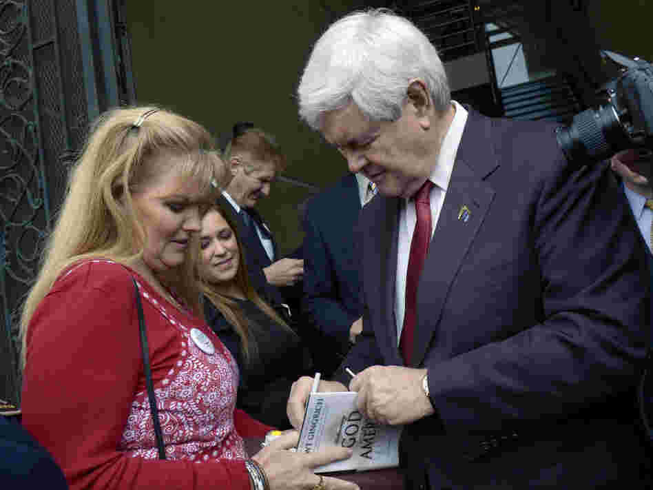 Newt Gingrich autographs a copy of his book in Orlando, Fla., Jan. 13. 