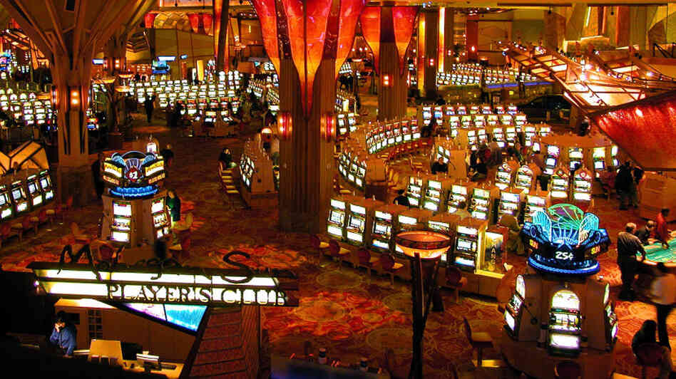 Gamblers play on some of the more than 6,000 slot machines at Mohegan Sun in Uncasville, Conn. The casino is owned and operated by the Mohegan Tribe. Gamblers play on some of the more than 6,000 slot machines at Mohegan Sun in Uncasville, Conn. The casino is owned and operated by the Mohegan Tribe.