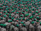 The U.S. military wants Afghan troops to begin taking the lead role in combat operations. Here, Afghan cadets who are joining the army are shown at their graduation ceremony on Dec. 18 in the northern city of Mazar-i-Sharif. The U.S. military wants Afghan troops to begin taking the lead role in combat operations. Here, Afghan cadets who are joining the army are shown at their graduation ceremony on Dec. 18 in the northern city of Mazar-i-Sharif.