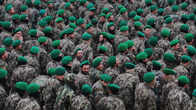 The U.S. military wants Afghan troops to begin taking the lead role in combat operations. Here, Afghan cadets who are joining the army are shown at their graduation ceremony on Dec. 18 in the northern city of Mazar-i-Sharif. 