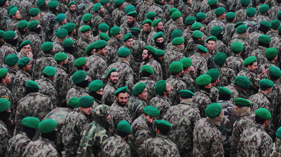 The U.S. military wants Afghan troops to begin taking the lead role in combat operations. Here, Afghan cadets who are joining the army are shown at their graduation ceremony on Dec. 18 in the northern city of Mazar-i-Sharif. 