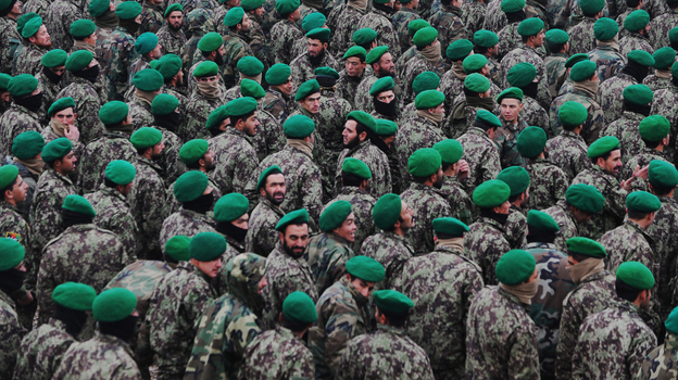 The U.S. military wants Afghan troops to begin taking the lead role in combat operations. Here, Afghan cadets who are joining the army are shown at their graduation ceremony on Dec. 18 in the northern city of Mazar-i-Sharif. The U.S. military wants Afghan troops to begin taking the lead role in combat operations. Here, Afghan cadets who are joining the army are shown at their graduation ceremony on Dec. 18 in the northern city of Mazar-i-Sharif.