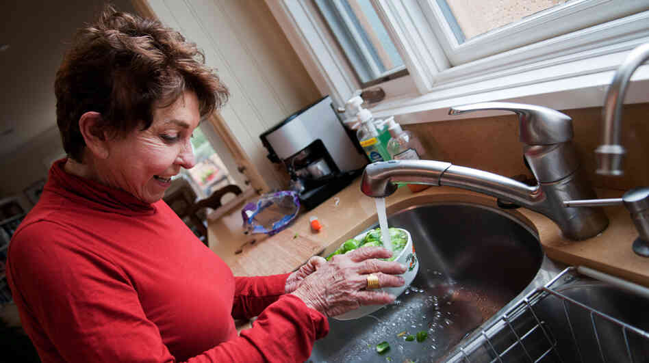 Sue Freeman, 78, washes Brussels sprouts at her home in Laguna Beach, Calif., on Saturday. Prior to getting an experimental stem-cell procedure last July, Freeman couldn't cook, read or recognize faces. Sue Freeman, 78, washes Brussels sprouts at her home in Laguna Beach, Calif., on Saturday. Prior to getting an experimental stem-cell procedure last July, Freeman couldn't cook, read or recognize faces.