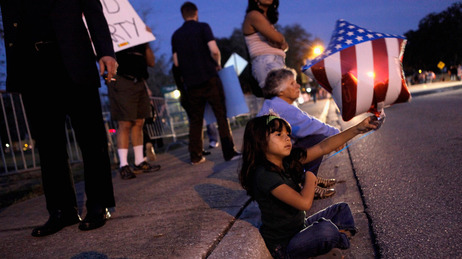 Six-year-old Maria Clara Riusech waved her balloon in the air earlier this evening outside the debate site at the University of South Florida in Tampa. Six-year-old Maria Clara Riusech waved her balloon in the air earlier this evening outside the debate site at the University of South Florida in Tampa.