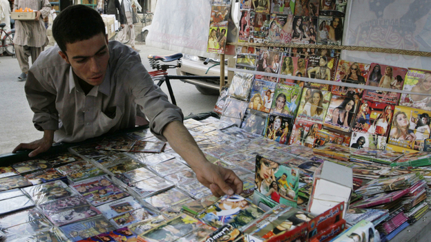 When the Taliban ruled Afghanistan, CDs and DVDs were forbidden. Now the Taliban are trying to attract recruits and supporters by making their own CDs. Here an Afghan man arranges DVDs for sale in the southern city of Kandahar in 2008. When the Taliban ruled Afghanistan, CDs and DVDs were forbidden. Now the Taliban are trying to attract recruits and supporters by making their own CDs. Here an Afghan man arranges DVDs for sale in the southern city of Kandahar in 2008.