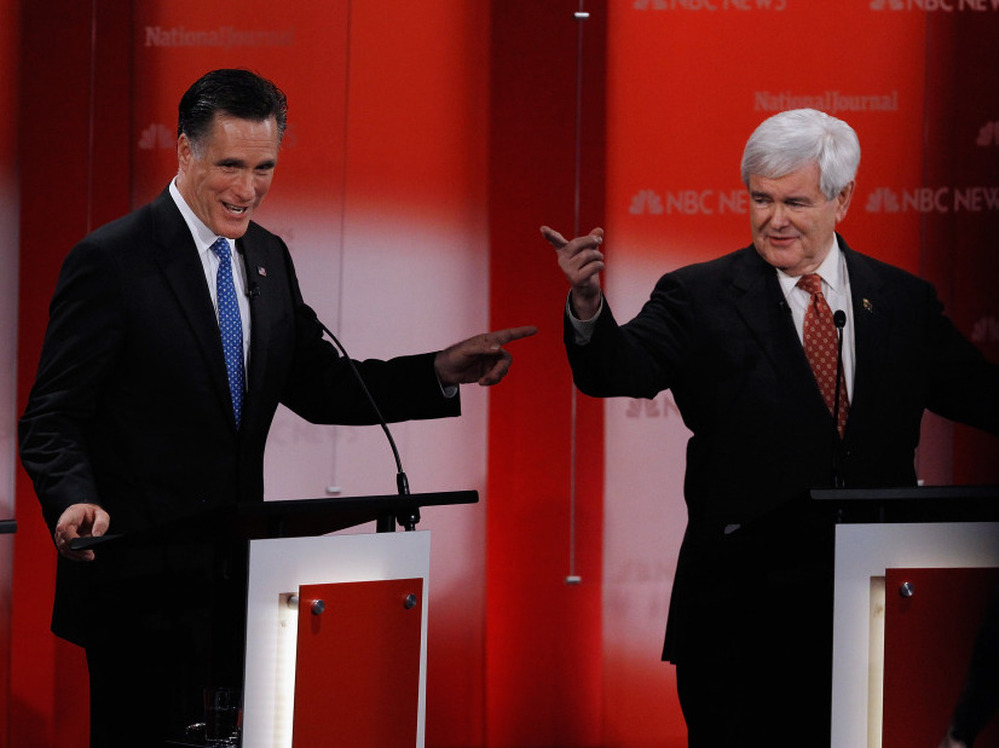 Former Massachusetts Gov. Mitt Romney and former House Speaker Newt Gingrich debate at the University of South Florida in Tampa on Monday.