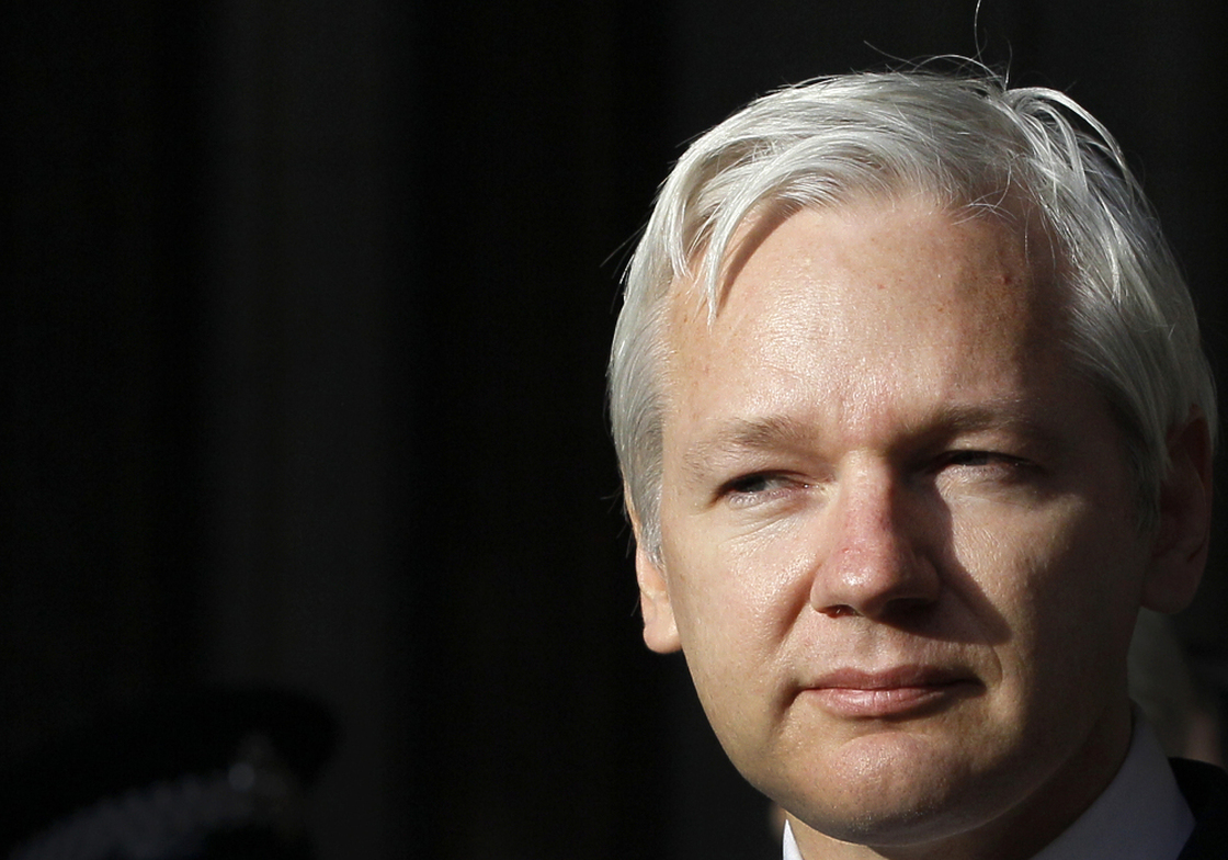 WikiLeaks founder Julian Assange pauses as he makes a statement to media gathered outside the High Court in London, last year.