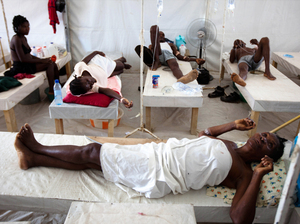 Haitians suffering from cholera symptoms rest at the treatment center in Mirebalais, a dusty town north of Port-au-Prince, Haiti, last June. The cholera epidemic in Haiti began in Mirebalais, believed to be the result of overflowing bathrooms from a nearby U.N. compound.