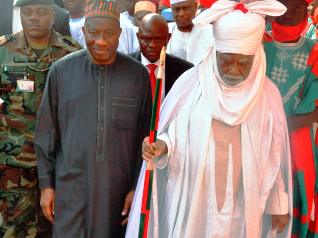 Nigerian President Goodluck Jonathan (left) walks with the Emir of Kano Ado Bayero during a one-day visit to the city that was rocked by recent attacks. 