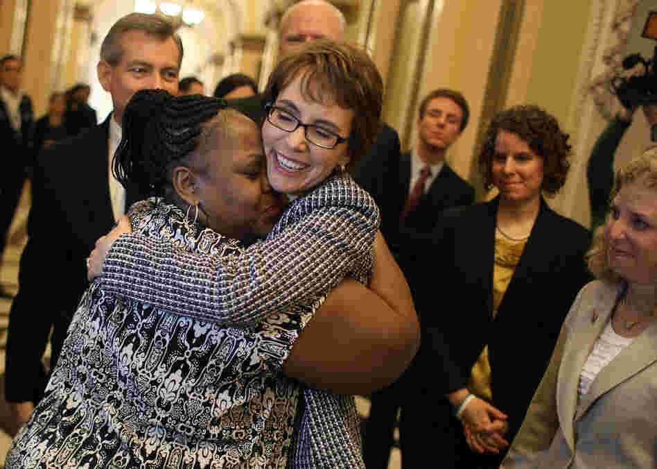 Former U.S. Rep. Gabrielle Giffords gets a hug from House Cloak Room attendant Ella Terry after she resigned from the House of Representatives on Wednesday. 