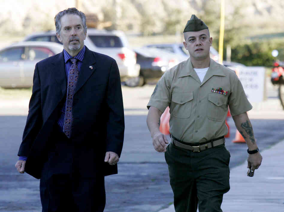 U.S. Marine Corps Staff Sgt. Frank Wuterich (R) walking into court with his defense attorney Neal Puckette for opening statements in the Haditha murders trial at Camp Pendleton on Jan. 9.