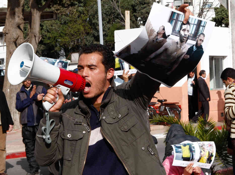 Demonstrators carry posters of Abdelwahab Zaydoun, who set himself on fire and died from his burns Tuesday. Zaydoun was part of a movement protesting unemployment in Morocco.