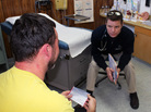 Dr. Dan Shuman (right), who was recruited to the Ashland Health Clinic as part of its mission-focused medicine program, consults with a patient about smoking cessation. Dr. Dan Shuman (right), who was recruited to the Ashland Health Clinic as part of its mission-focused medicine program, consults with a patient about smoking cessation.