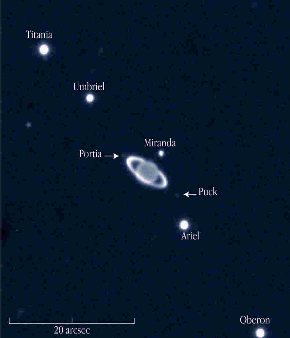 A near-infrared view of the giant planet Uranus with rings and some of its moons, taken by the European Southern Observatory in 2002.