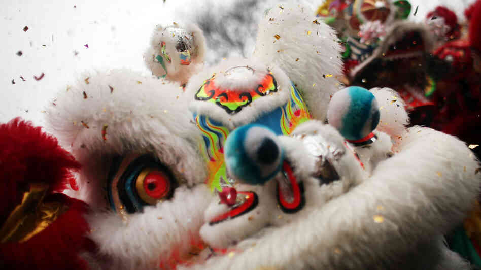 A traditional dance troupe performs in New York's Chinatown to celebrate the Chinese New Year. For many children adopted from China, the holiday is a time to learn about their heritage.