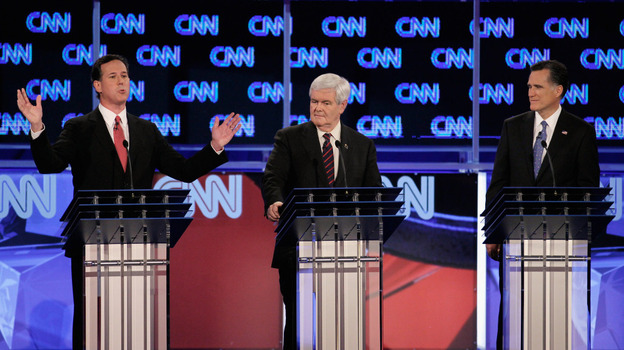 Rick Santorum (from left), Newt Gingrich and Mitt Romney debate Thursday night in Jacksonville, Fla.