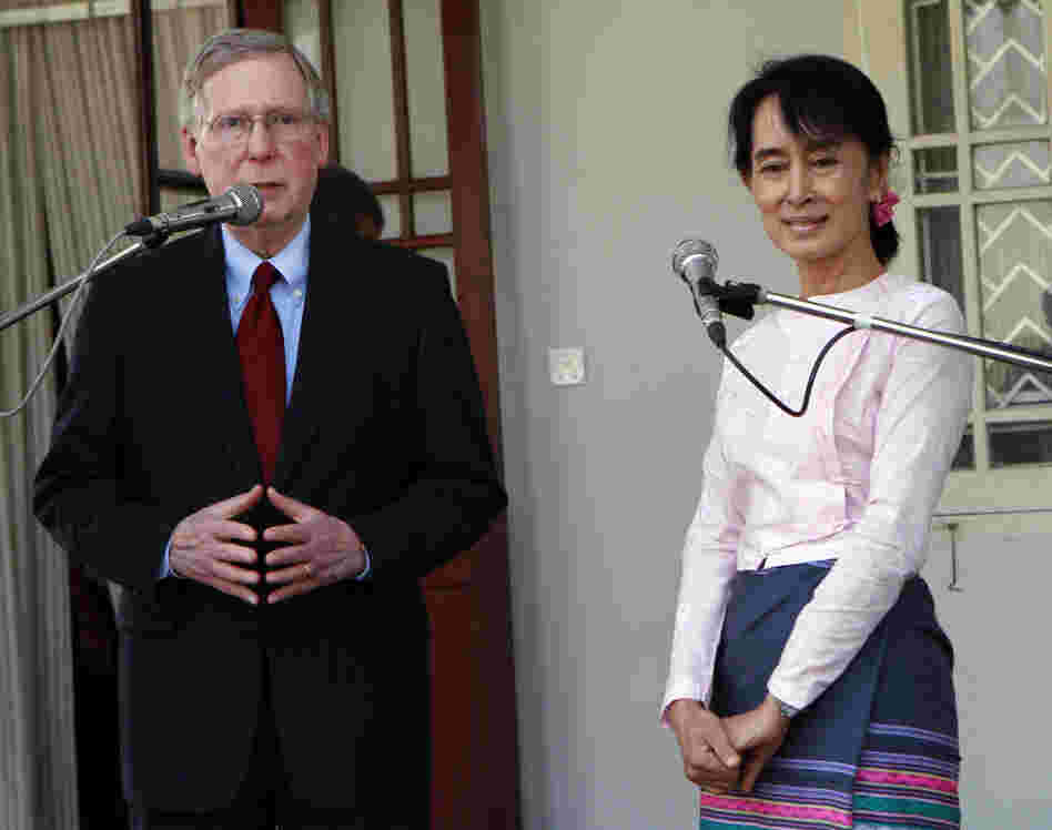 U.S. Senator Mitch McConnell talks as Myanmar pro-democracy leader Aung San Suu Kyi listens during a press conference after their meeting at her home in Yangon, Myanmar on Monday.