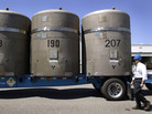 Without a centralized national repository for nuclear waste, the radioactive material is currently being kept at various sites across the country. Above, large concrete canisters, each holding 14 55-gallon drums of waste, are loaded on a truck in 2005 in Richland, Wash., where they were later shipped to a facility in New Mexico. Without a centralized national repository for nuclear waste, the radioactive material is currently being kept at various sites across the country. Above, large concrete canisters, each holding 14 55-gallon drums of waste, are loaded on a truck in 2005 in Richland, Wash., where they were later shipped to a facility in New Mexico.
