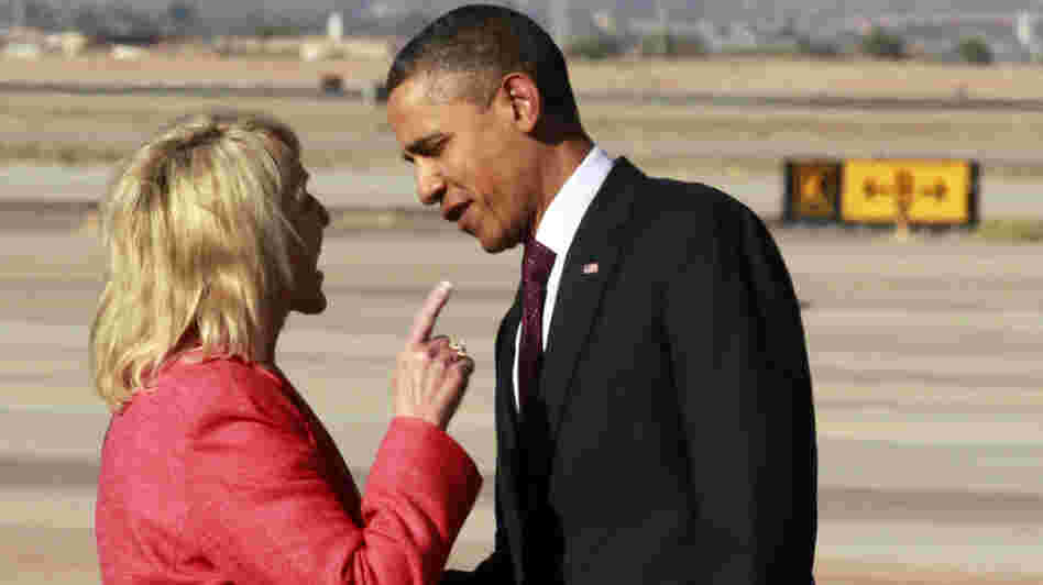 Arizona Gov. Jan Brewer points at President Obama after he arrived at Phoenix-Mesa Gateway Airport on Wednesday.