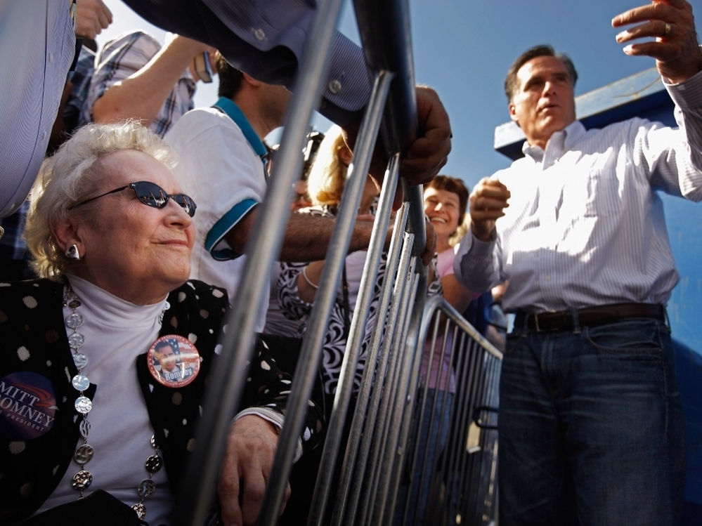 Former Massachusetts Gov. Mitt Romney greets supporters during a campaign event at Paramount Printing in Jacksonville, Fla., on Thursday. 