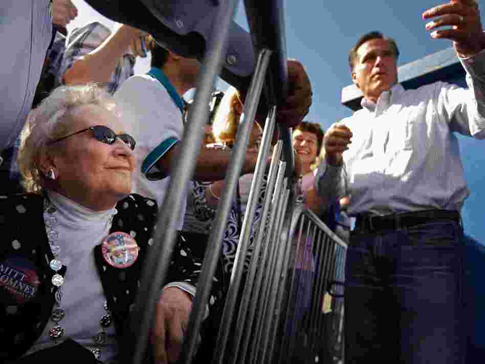 Former Massachusetts Gov. Mitt Romney greets supporters during a campaign event at Paramount Printing in Jacksonville, Fla., on Thursday. 
