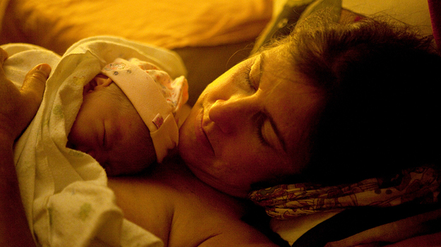 Shannon Earle holds her new baby Kiera Breen Earle, moments after she was born at their home last year.