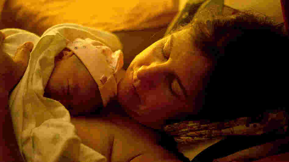 Shannon Earle holds her new baby Kiera Breen Earle, moments after she was born at their home last year.