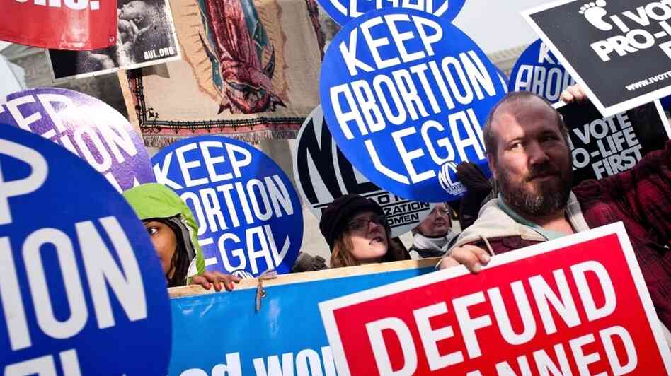 Activists on both sides of the abortion issue attend a vigil outside the U.S. Supreme Court on Jan. 23. The vigil was held to mark the anniversary of the Roe v. Wade Supreme Court decision that legalized abortion. Anti-abortion groups plan to push several bills this year that would restrict abortions. Activists on both sides of the abortion issue attend a vigil outside the U.S. Supreme Court on Jan. 23. The vigil was held to mark the anniversary of the Roe v. Wade Supreme Court decision that legalized abortion. Anti-abortion groups plan to push several bills this year that would restrict abortions.