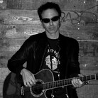 Nils Lofgren specializes in high-energy blues-rock. Nils Lofgren specializes in high-energy blues-rock.