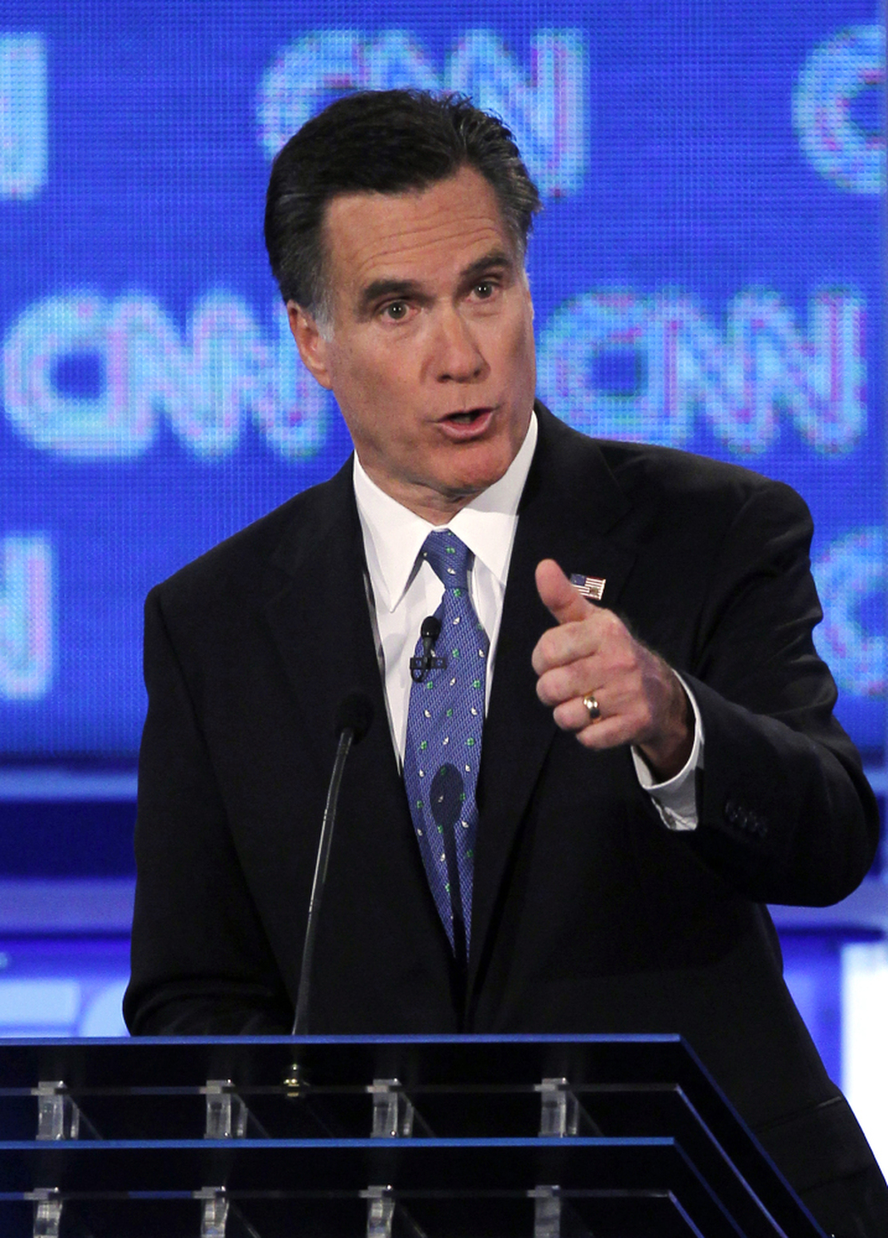 Former Massachusetts Gov. Mitt Romney offered a spirited defense of the individual mandate during Thursday night's GOP presidential candidate debate in Jacksonville, Fla. 