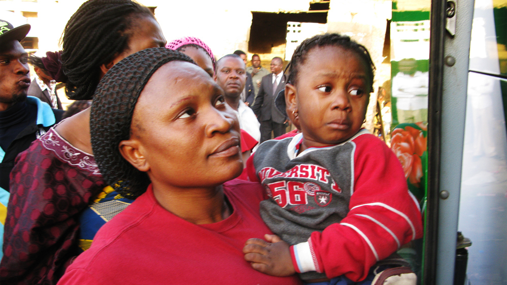 Glory Ndudi, a Christian, and her five children board a bus headed out of town on Wednesday. The recent bomb attacks that have targeted churches in Kano, Nigeria, have led to an exodus of Christians from the city. 