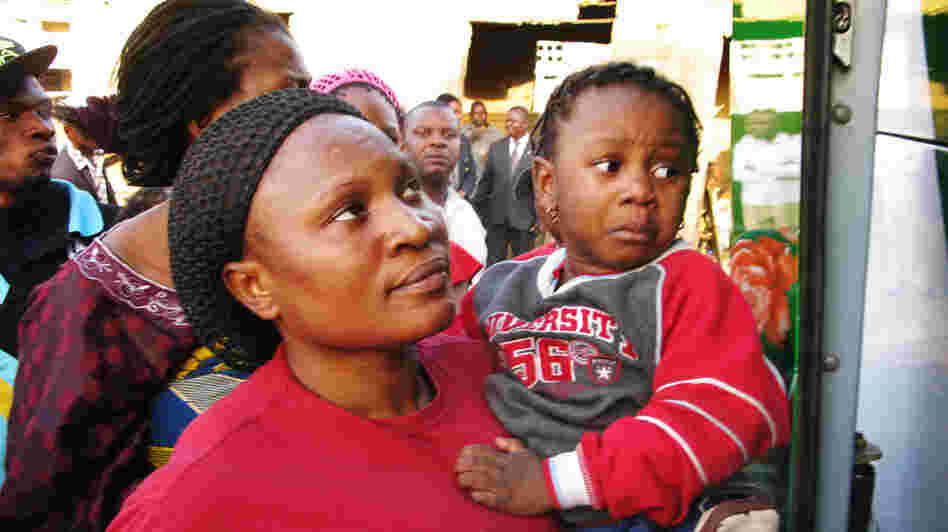 Glory Ndudi, a Christian, and her five children board a bus headed out of town on Wednesday. The recent bomb attacks that have targeted churches in Kano, Nigeria, have led to an exodus of Christians from the city. 