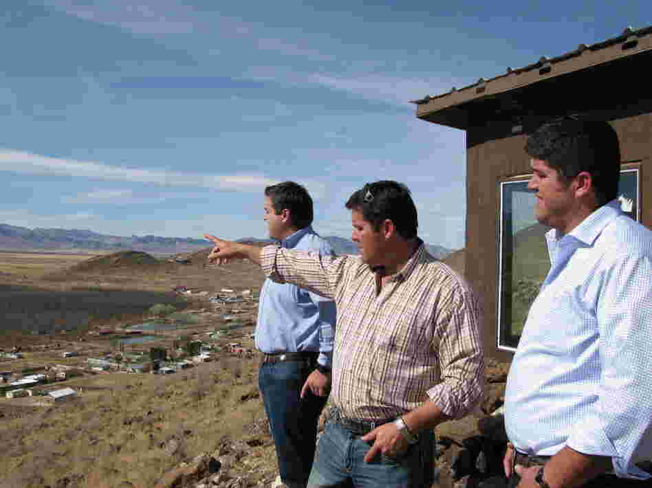 Alex, Daniel and Max LeBaron look out over Colonia LeBaron in Chihuahua, Mexico, in front of a shack they built as a lookout against approaching criminals. The murder of two citizens galvanized this community to protect itself, Alex says.