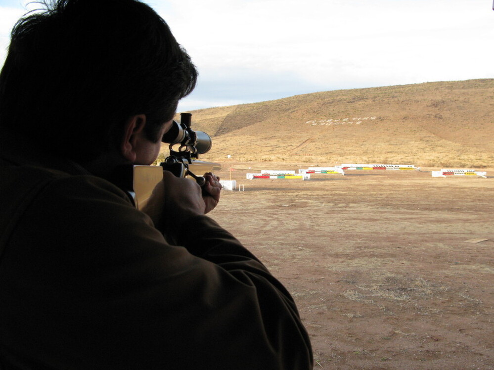 Alex LeBaron points his gun toward a target at a local shooting club. If Alex makes it into the federal Congress, his most passionate issue will be changing Mexico's gun laws.